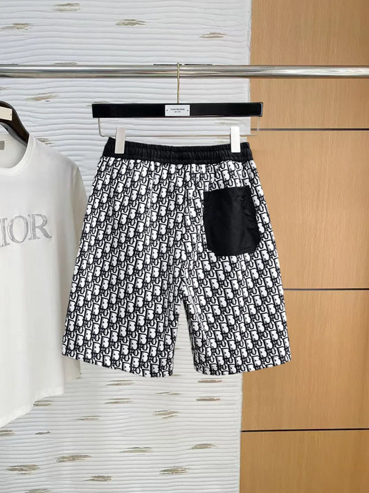 All‑Over Monogram Print Spliced Shorts