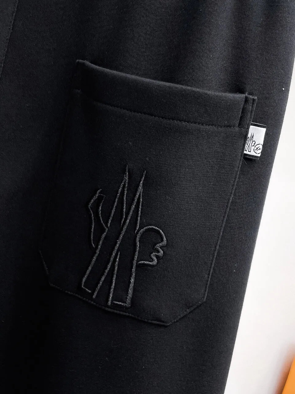 Chest Embroidered Badge Back‑Pocket Motif Pants
