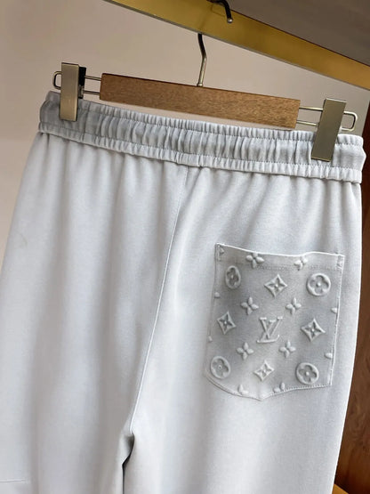 Embossed Monogram Patch Pocket Straight‑Leg Pants