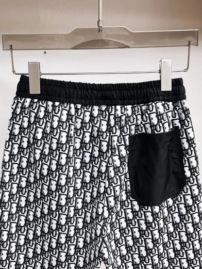 All‑Over Monogram Print Spliced Shorts