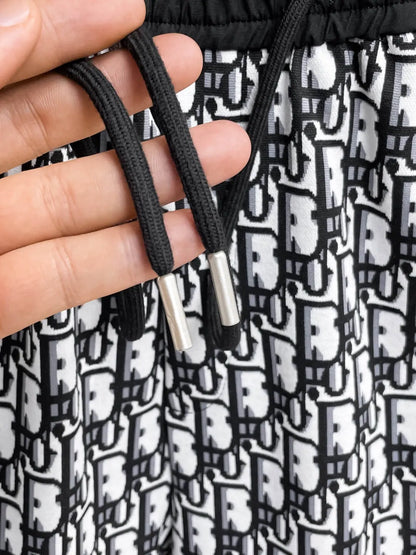 All‑Over Monogram Print Spliced Shorts