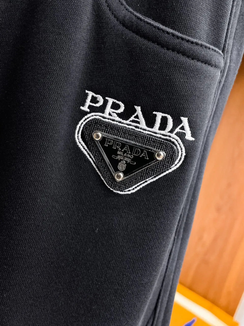 Triangle Badge Seam‑Detail Pants