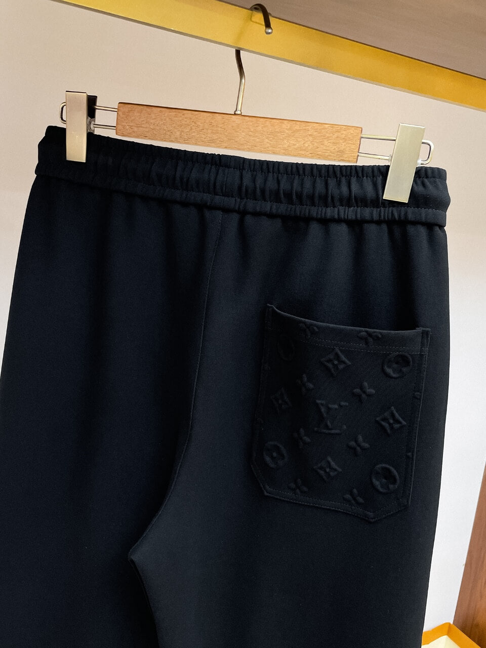 Embossed Monogram Patch Pocket Wide‑Leg Pants