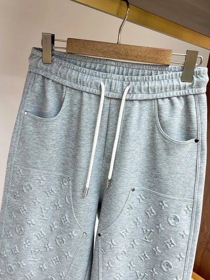 Embossed Monogram Patch Pocket Wide‑Leg Pants