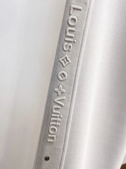 Side‑Embossed Letter Snap‑Detail Pants
