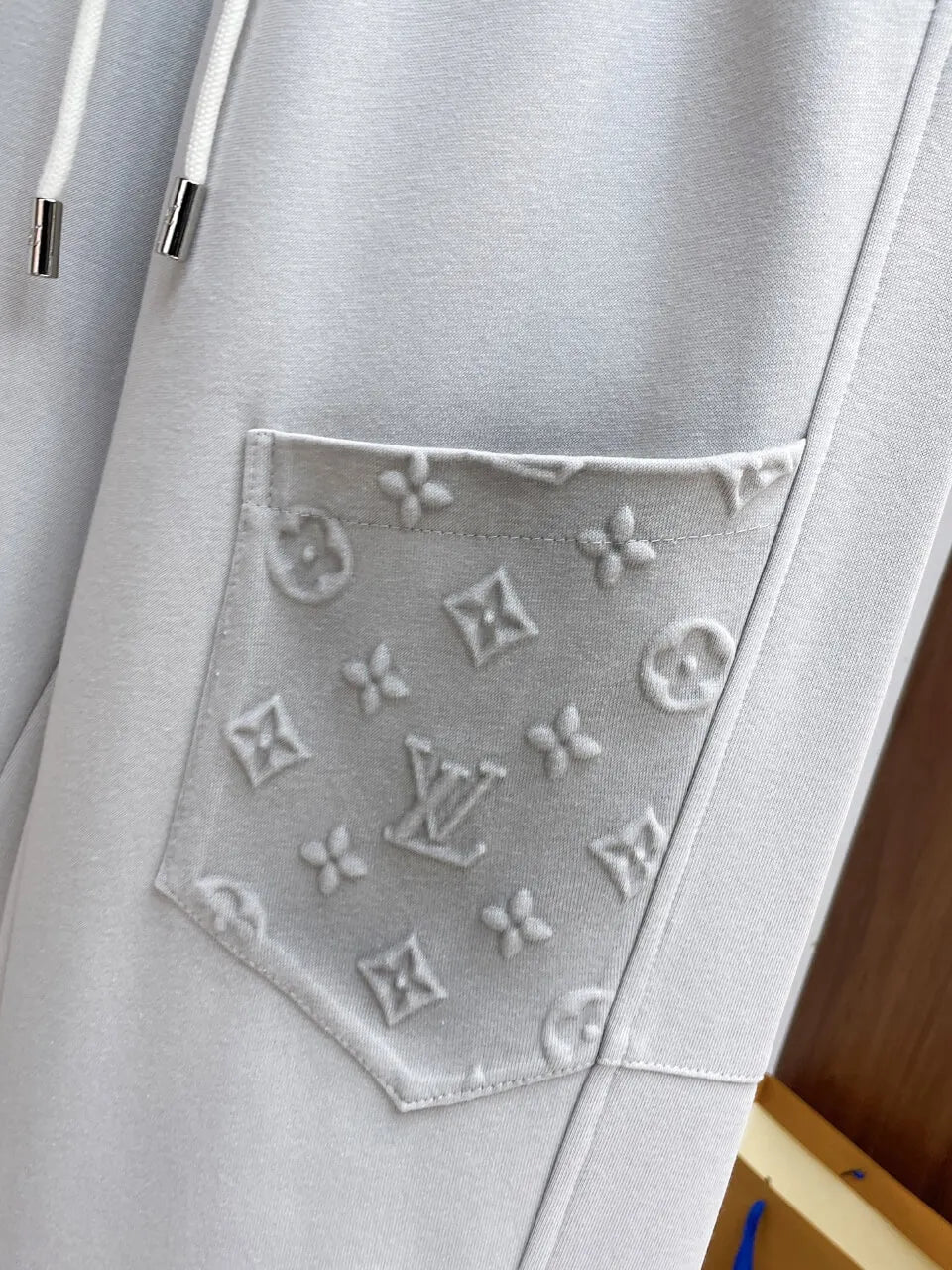 Embossed Monogram Patch Pocket Straight‑Leg Pants