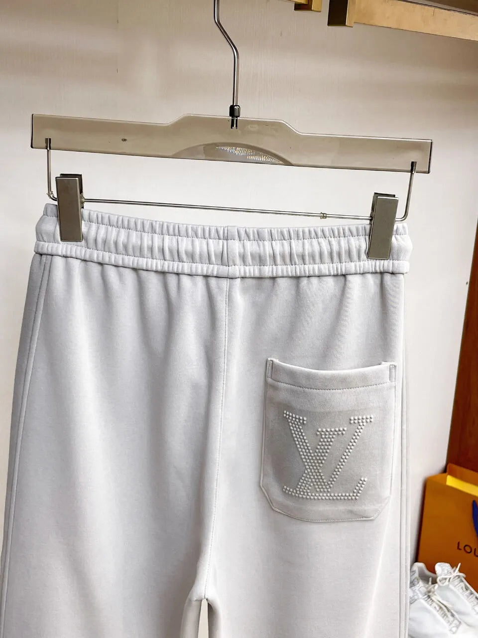 Side‑Embossed Letter Snap‑Detail Pants