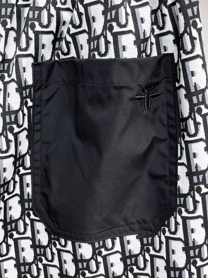 All‑Over Monogram Print Spliced Shorts