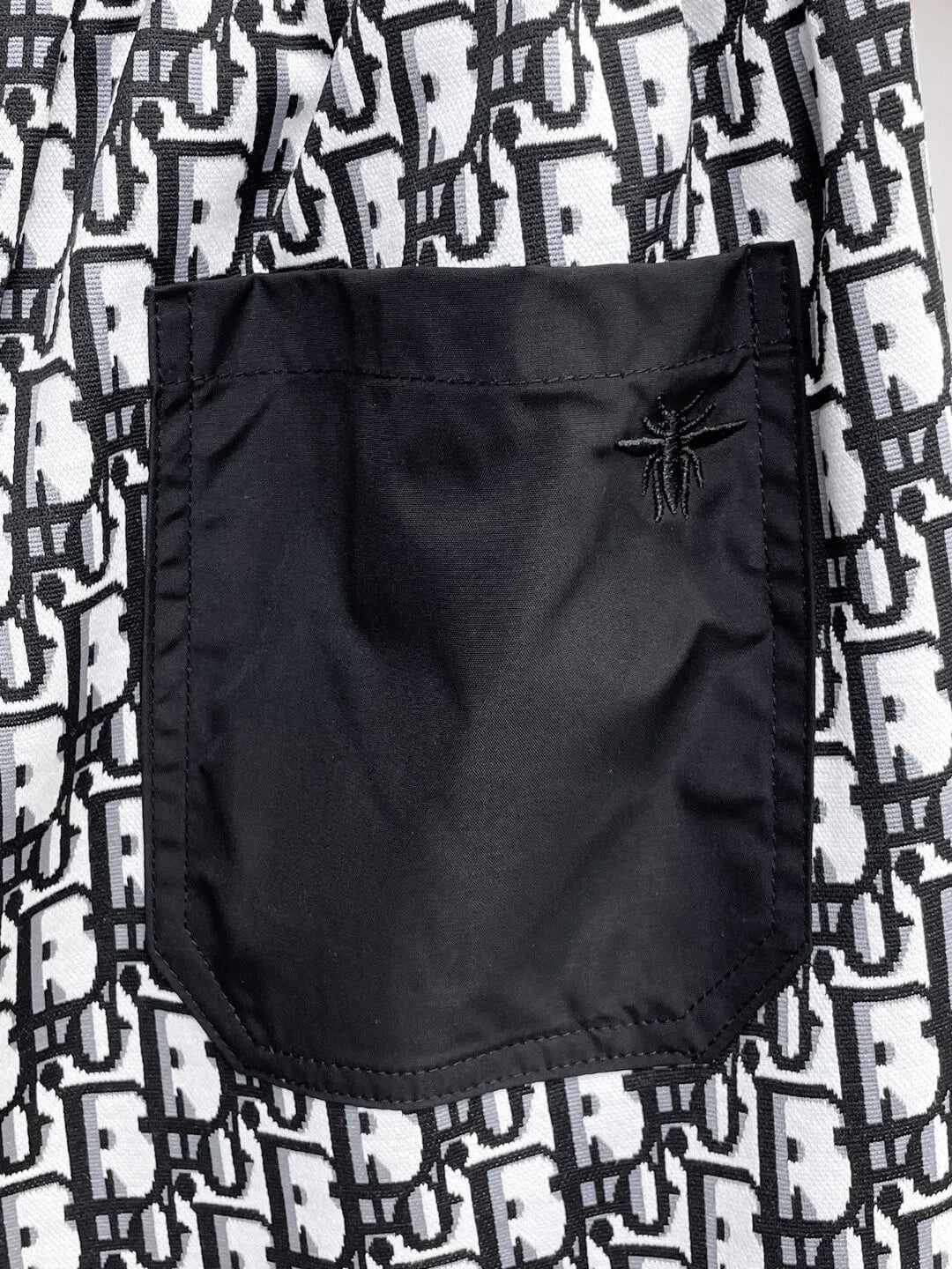 All‑Over Monogram Print Spliced Shorts