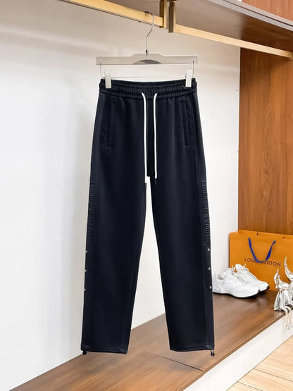 Side‑Embossed Letter Snap‑Detail Pants