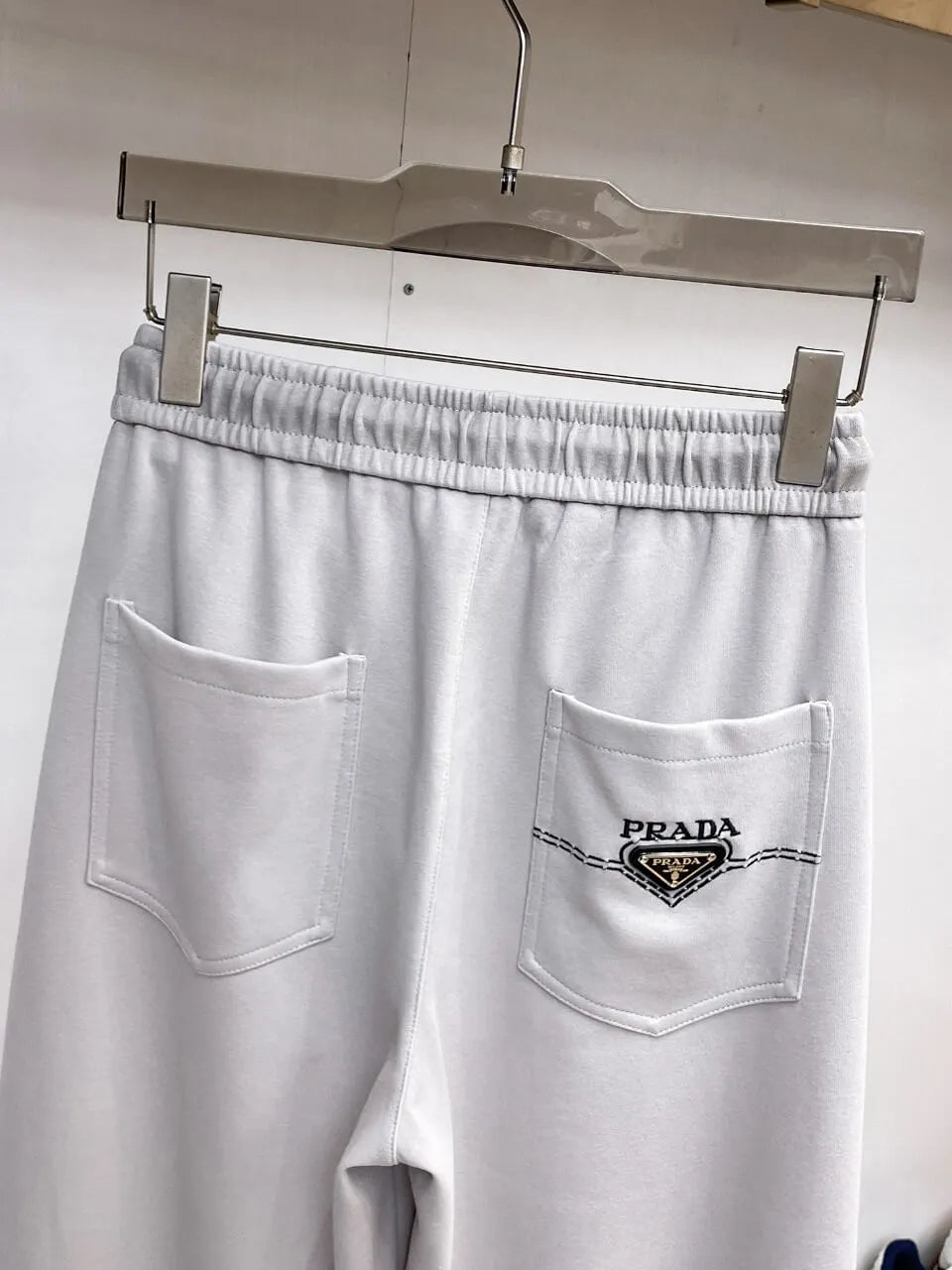 Triangle Badge Seam‑Detail Pants
