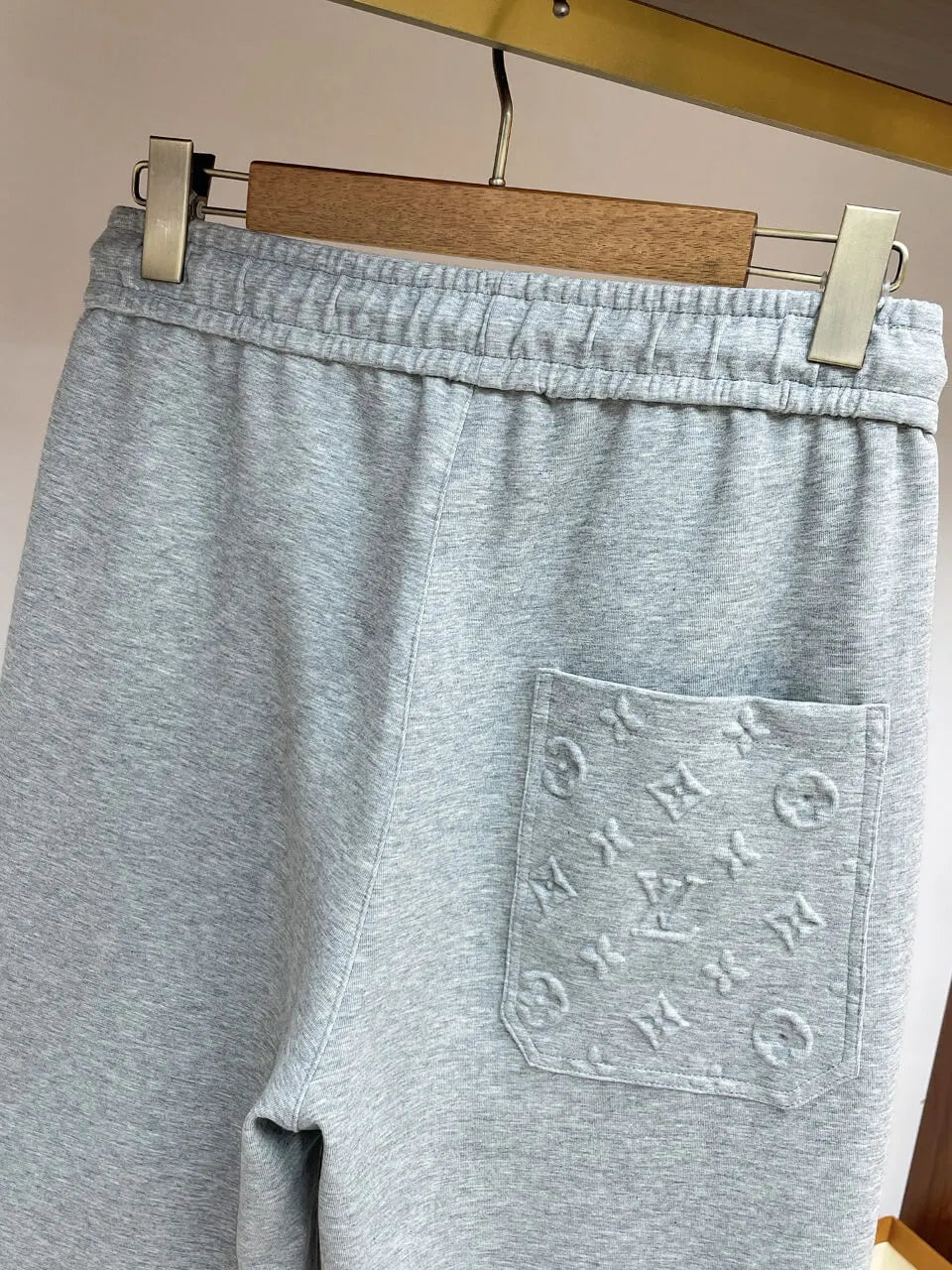 Embossed Monogram Patch Pocket Wide‑Leg Pants