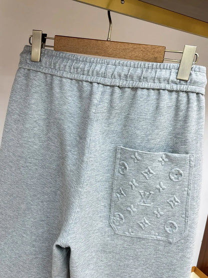 Embossed Monogram Patch Pocket Wide‑Leg Pants