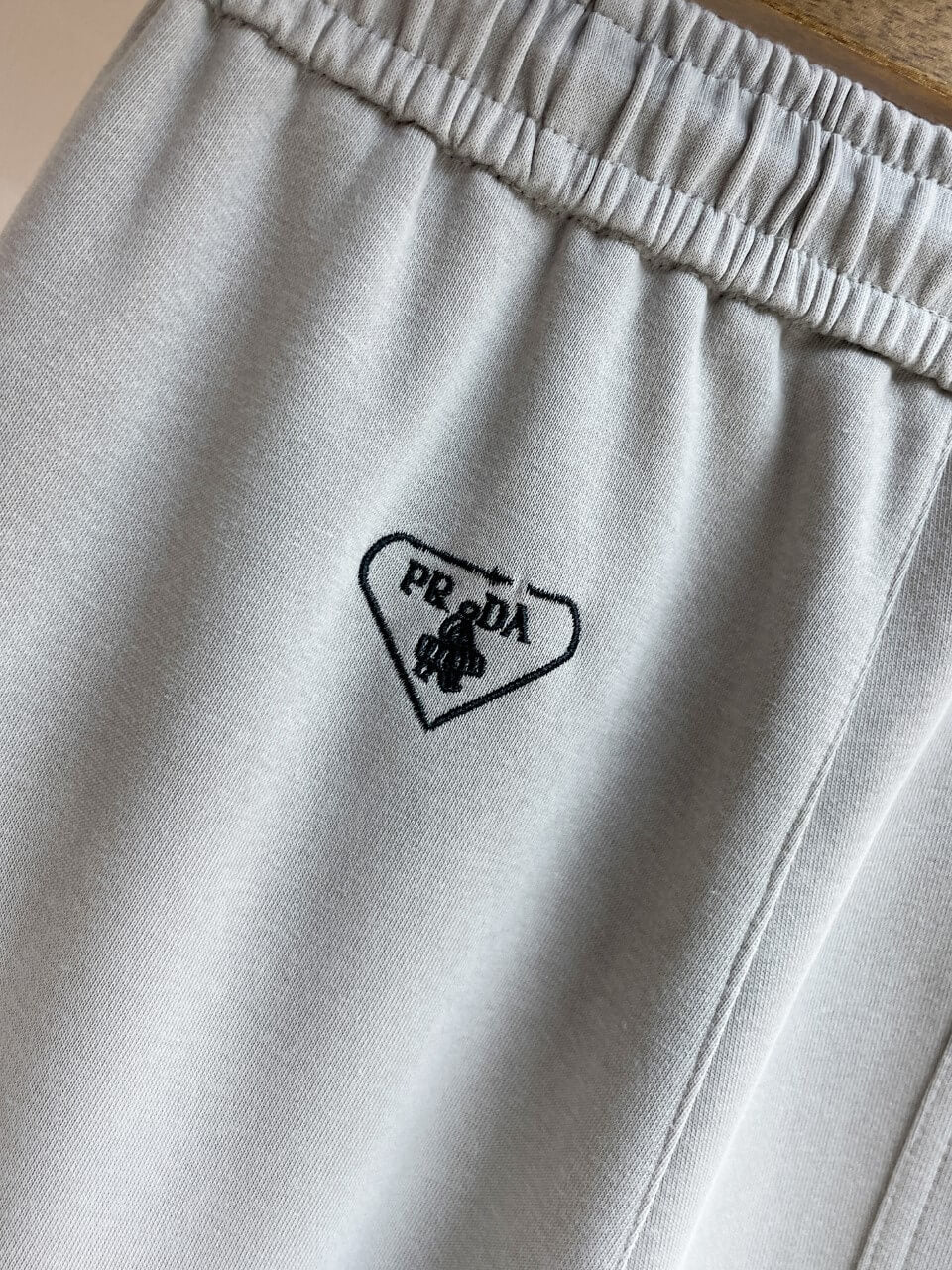 Triangle Badge Multi‑Pocket Cargo Pants