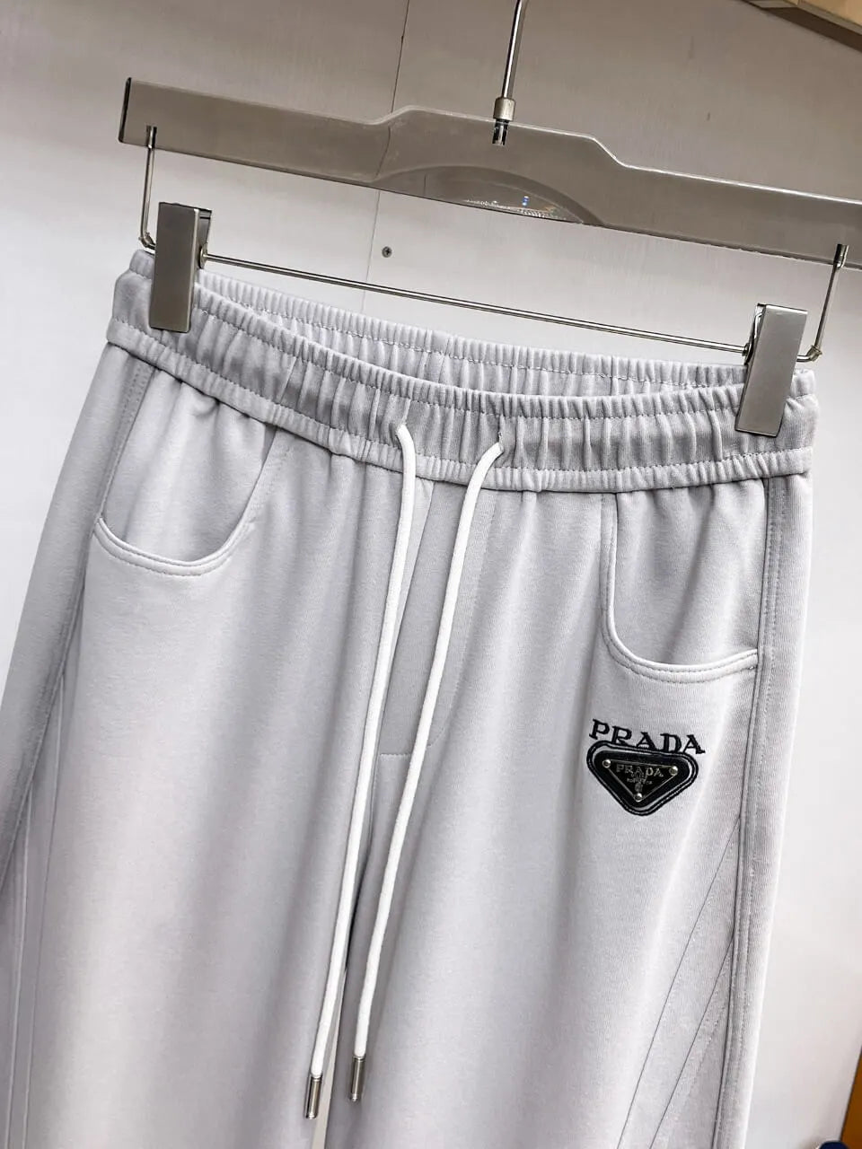 Triangle Badge Seam‑Detail Pants