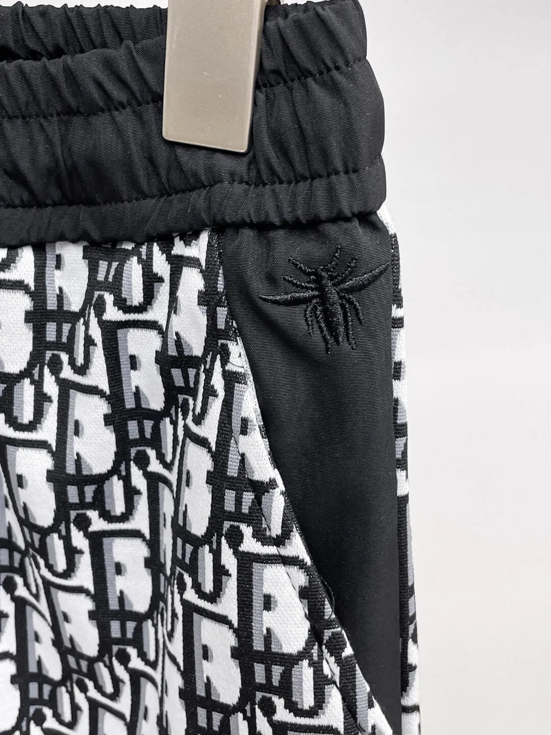 All‑Over Monogram Print Spliced Shorts