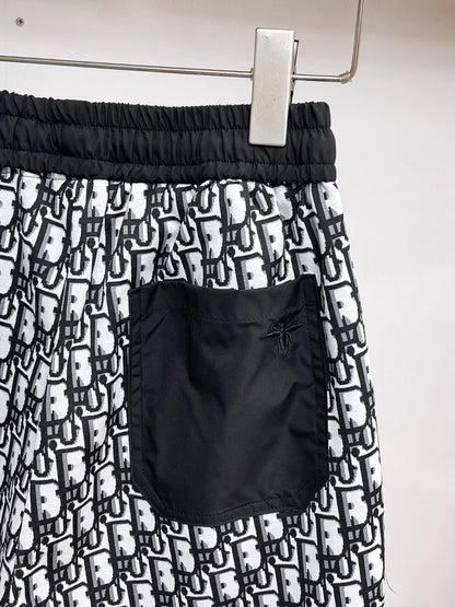 All‑Over Monogram Print Spliced Shorts