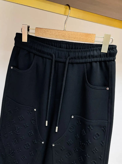 Embossed Monogram Patch Pocket Wide‑Leg Pants