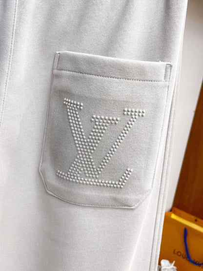 Side‑Embossed Letter Snap‑Detail Pants