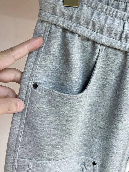 Embossed Monogram Patch Pocket Wide‑Leg Pants