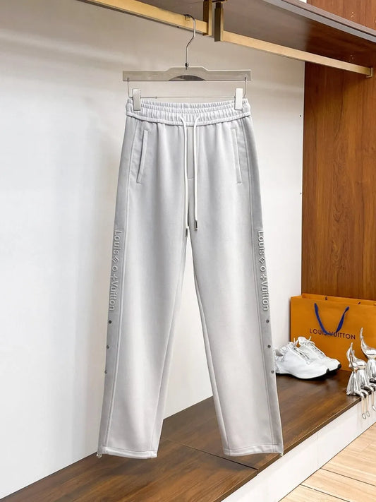 Side‑Embossed Letter Snap‑Detail Pants